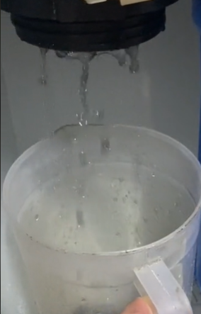 A close-up of a water tap

Description automatically generated