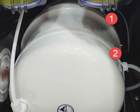 A white cylinder with two red circles

Description automatically generated with medium confidence
